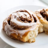 Close-up of soft and fluffy cinnamon rolls, showing spirals of cinnamon sugar filling, delicious and inviting.