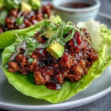 Savory seasoned turkey filling nestled in crisp lettuce cups, perfect for dinner.
