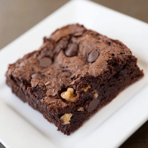 Fudgy, crackly-topped brownies: squares of rich chocolate bliss, inviting you to take a bite.