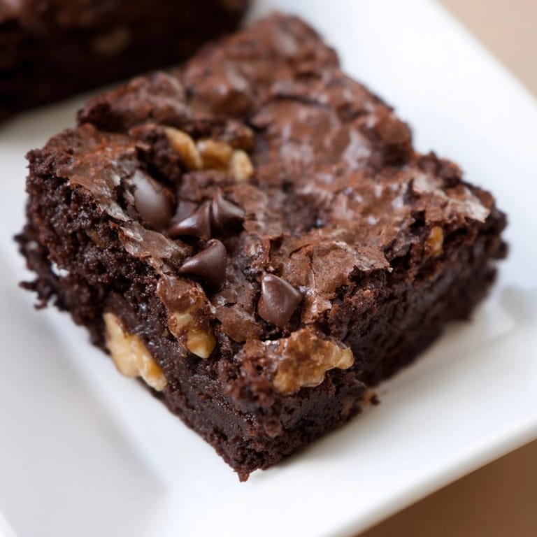 Perfect homemade brownies, beautifully cut, ready to be served; a quintessential American dessert.