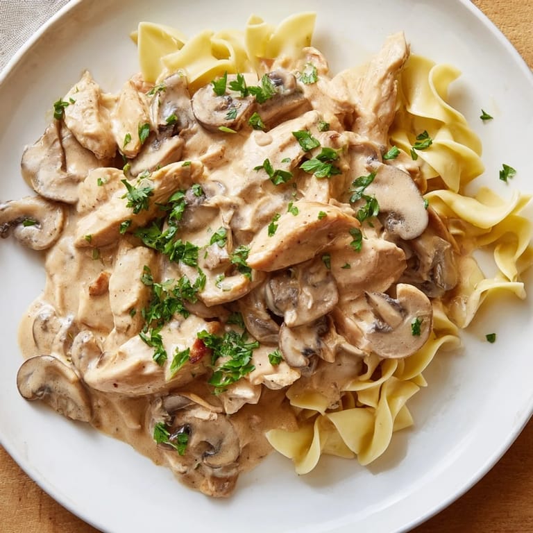 Hearty Chicken and Mushroom Stroganoff garnished with fresh parsley, ready to be enjoyed as a comforting main dish.