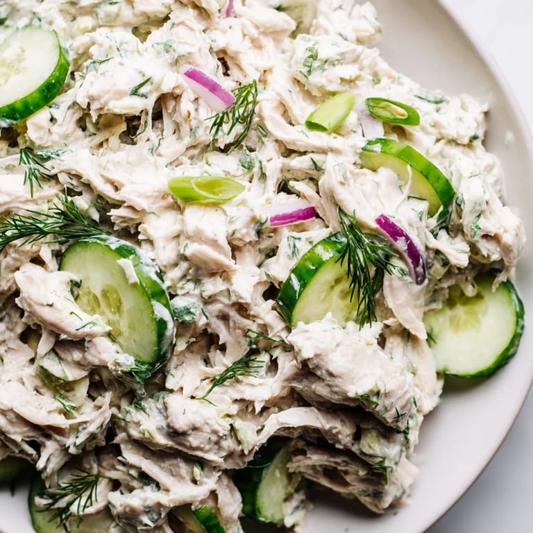 Bright bowl of protein-rich Creamy Cucumber Chicken Salad with tender chicken and crisp cucumbers in creamy dressing, served as a refreshing light dinner.