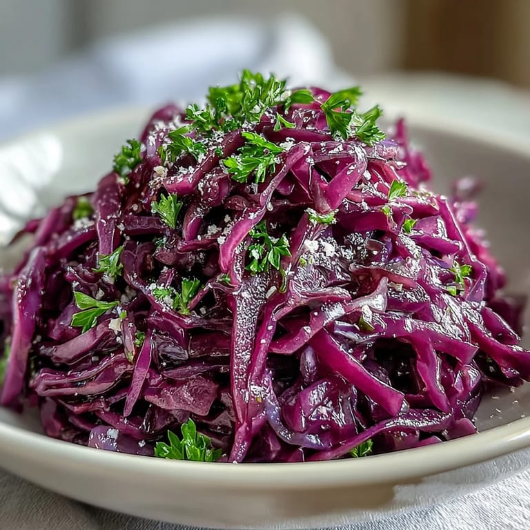 Tangy vinaigrette coats the vibrant salad, served as a refreshing side dish.